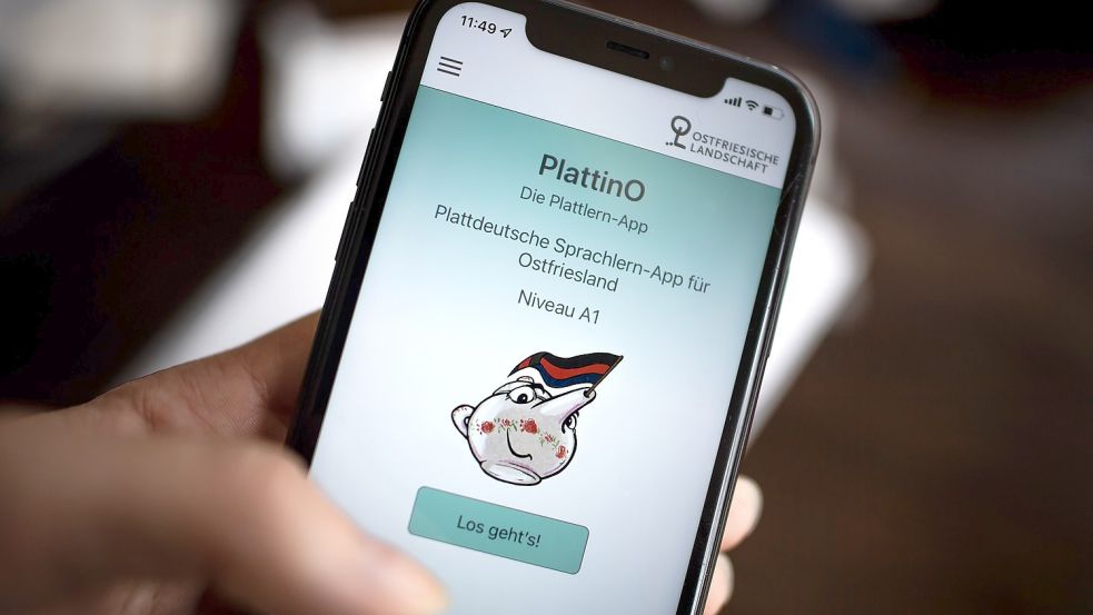 Die Sprachlern-App „PlattinO“ auf einem Smartphone. Foto: Schuldt/dpa